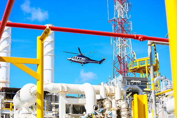 helicopter parking landing on offshore platform, Helicopter transfer crews or passenger to work in offshore oil and gas industry, air transportation for support passenger, ground service in airport.